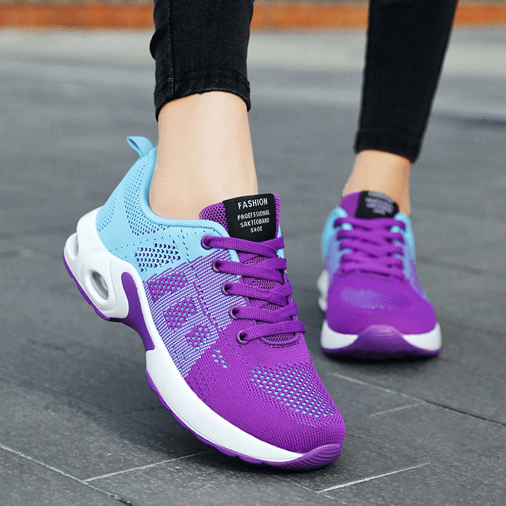 Person wearing breathable wear-resistant lace-up cushioned running shoes SF0888 in purple and blue, perfect for stability and comfort.